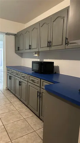 a kitchen with stainless steel appliances a cabinets and a counter top space
