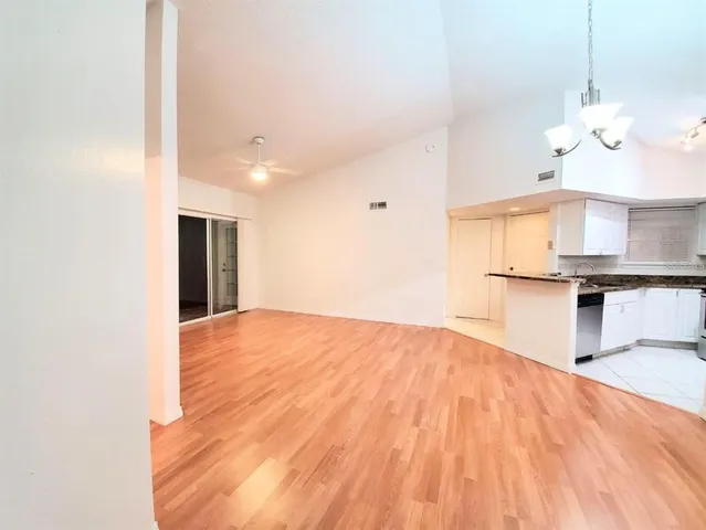 a view of a kitchen with a sink and a stove