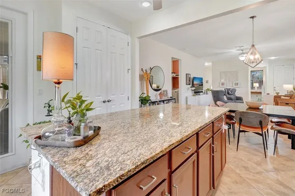 a bathroom with a granite countertop sink a large mirror and a shower