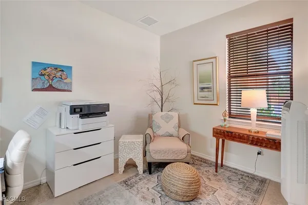 a room with a bed and a table in it
