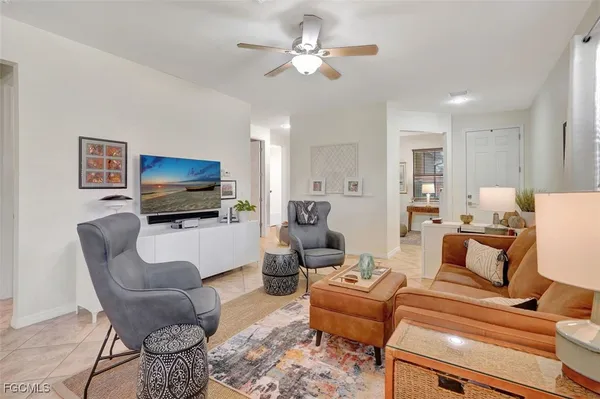a kitchen with stainless steel appliances granite countertop a refrigerator a sink dishwasher a stove and a refrigerator with wooden floor