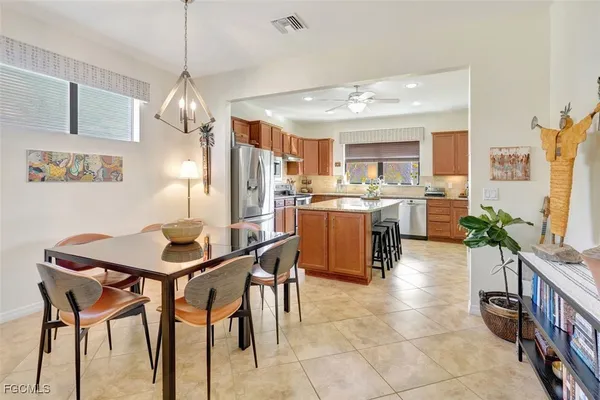 a kitchen with granite countertop a stove sink and cabinets