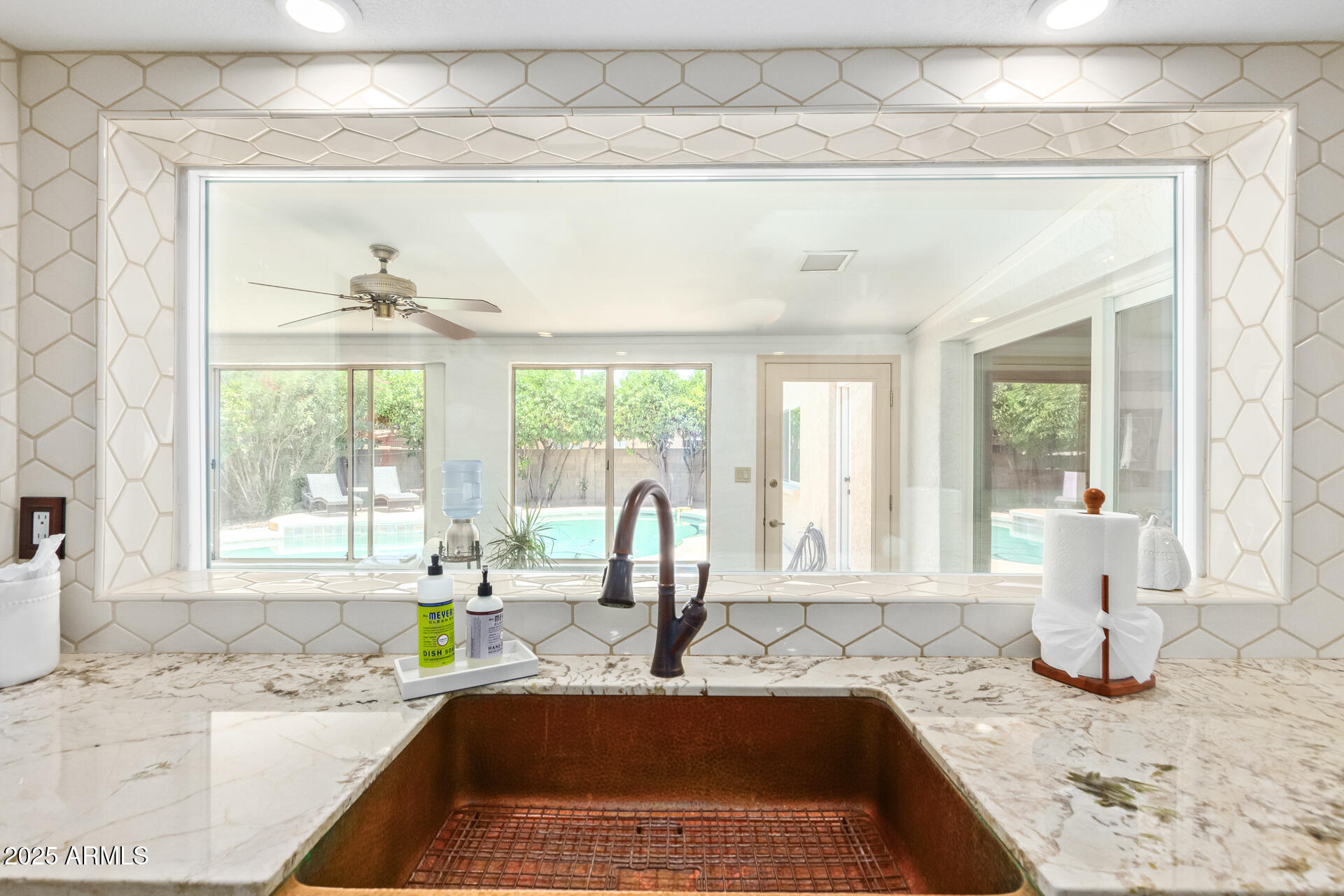 2118 East Pebble Beach Drive Tempe, AZ 85282 - Photo 12 of 33 a kitchen with a granite countertop sink and window