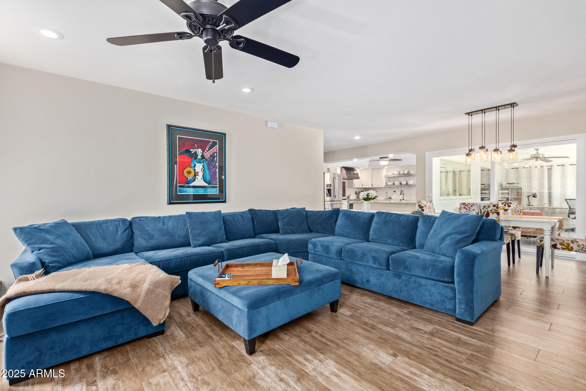 2118 East Pebble Beach Drive Tempe, AZ 85282 - Photo 2 of 33 a living room with furniture kitchen view and a chandelier