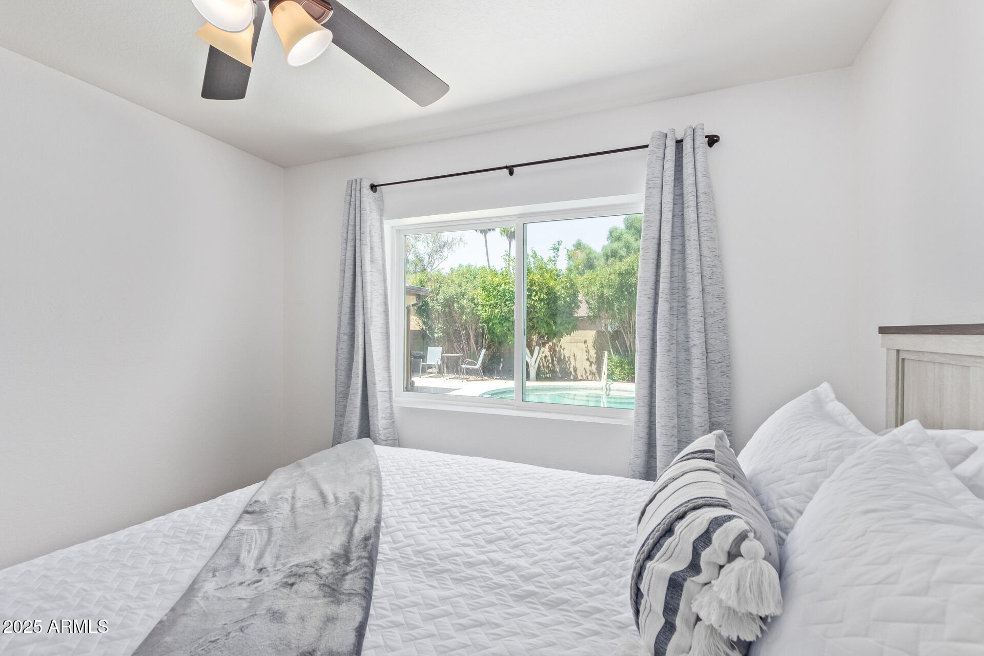 2118 East Pebble Beach Drive Tempe, AZ 85282 - Photo 21 of 33 a bedroom with a bed and a window