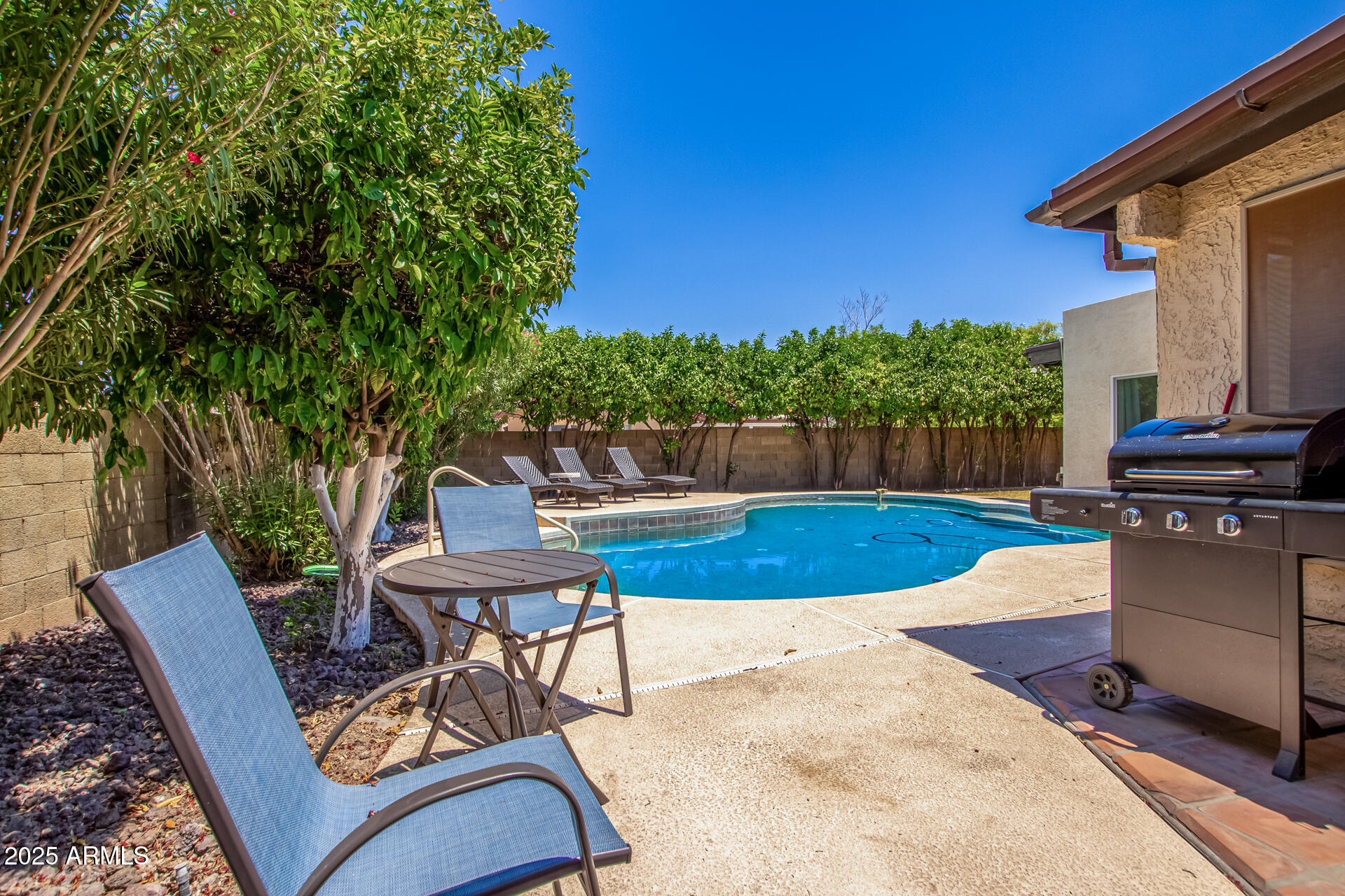 2118 East Pebble Beach Drive Tempe, AZ 85282 - Photo 33 of 33 a view of a chairs and table in backyard