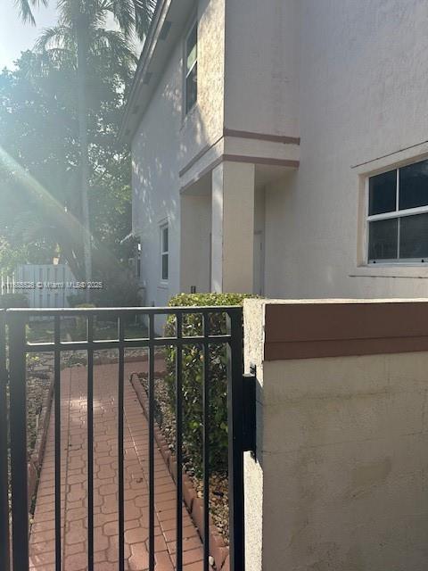 171 Northwest 75th Terrace Plantation, FL 33317 - Photo 6 of 32 Gate to pass through to front entrance then foyer
