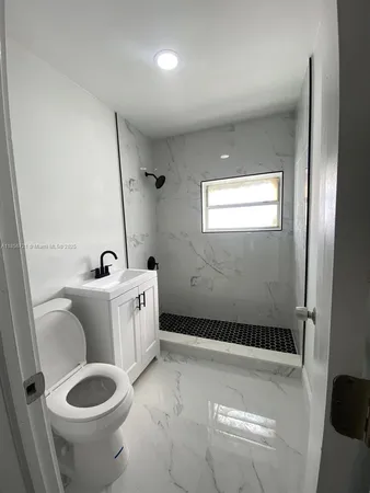 a bathroom with a toilet and a sink