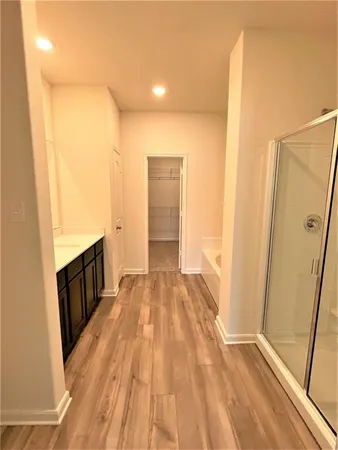 a view of hallway with wooden floor
