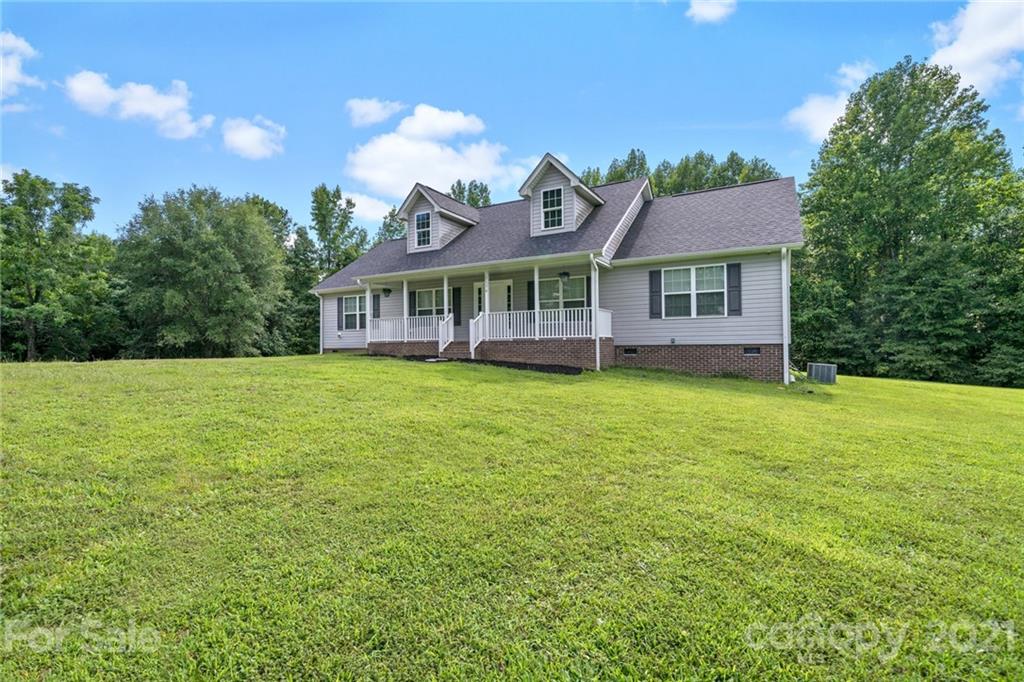 1174 South Rutherford Street Blacksburg, SC 29702 - Photo 2 of 40 a view of a house with a big yard and a large tree center