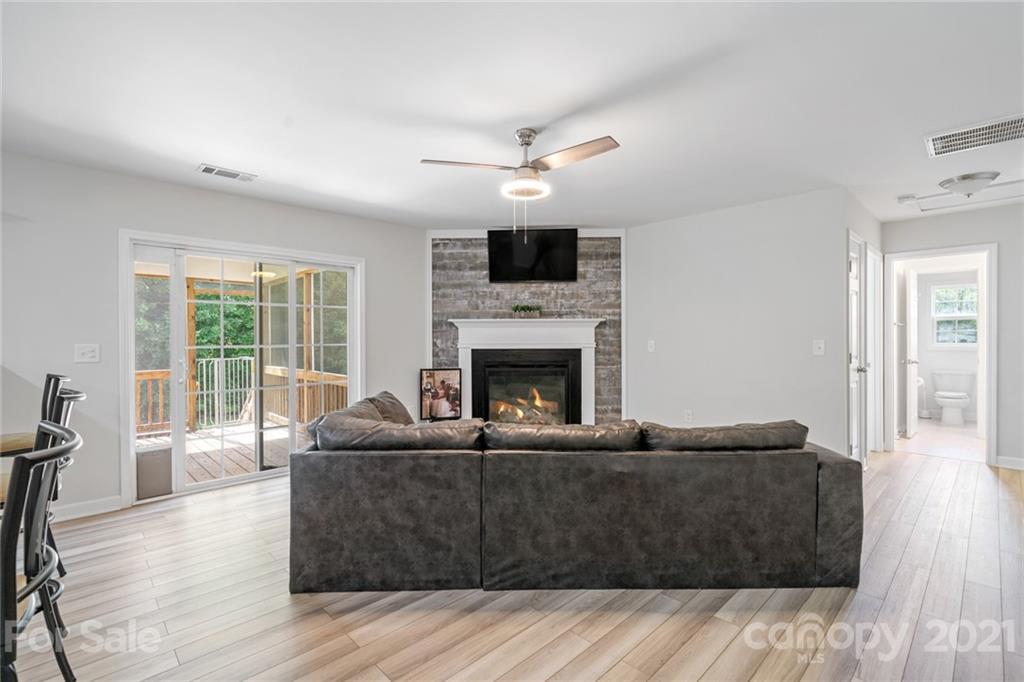 1174 South Rutherford Street Blacksburg, SC 29702 - Photo 12 of 40 a living room with furniture and a fireplace