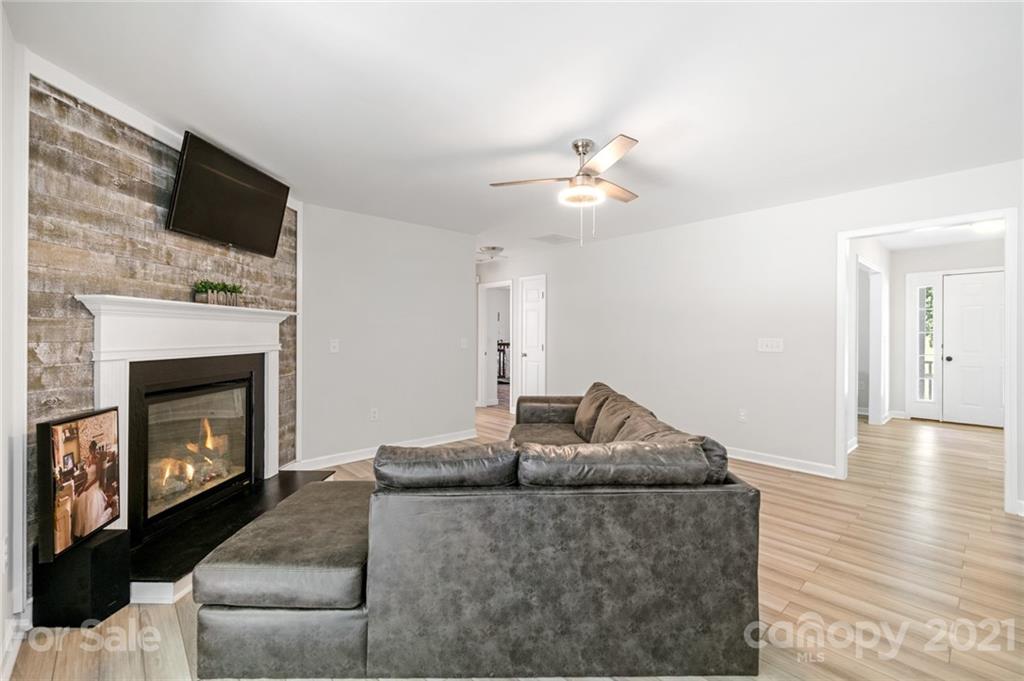 1174 South Rutherford Street Blacksburg, SC 29702 - Photo 13 of 40 a living room with furniture and a fireplace