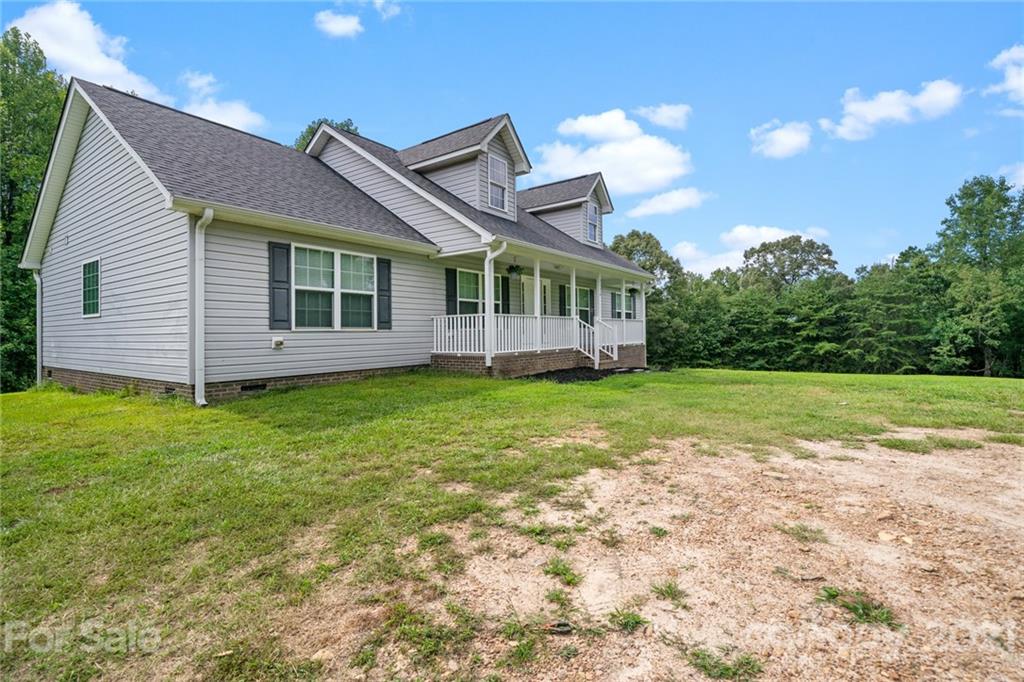 1174 South Rutherford Street Blacksburg, SC 29702 - Photo 3 of 40 a view of a house with a backyard