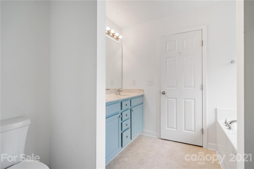 1174 South Rutherford Street Blacksburg, SC 29702 - Photo 22 of 40 a bathroom with a granite countertop sink and a toilet
