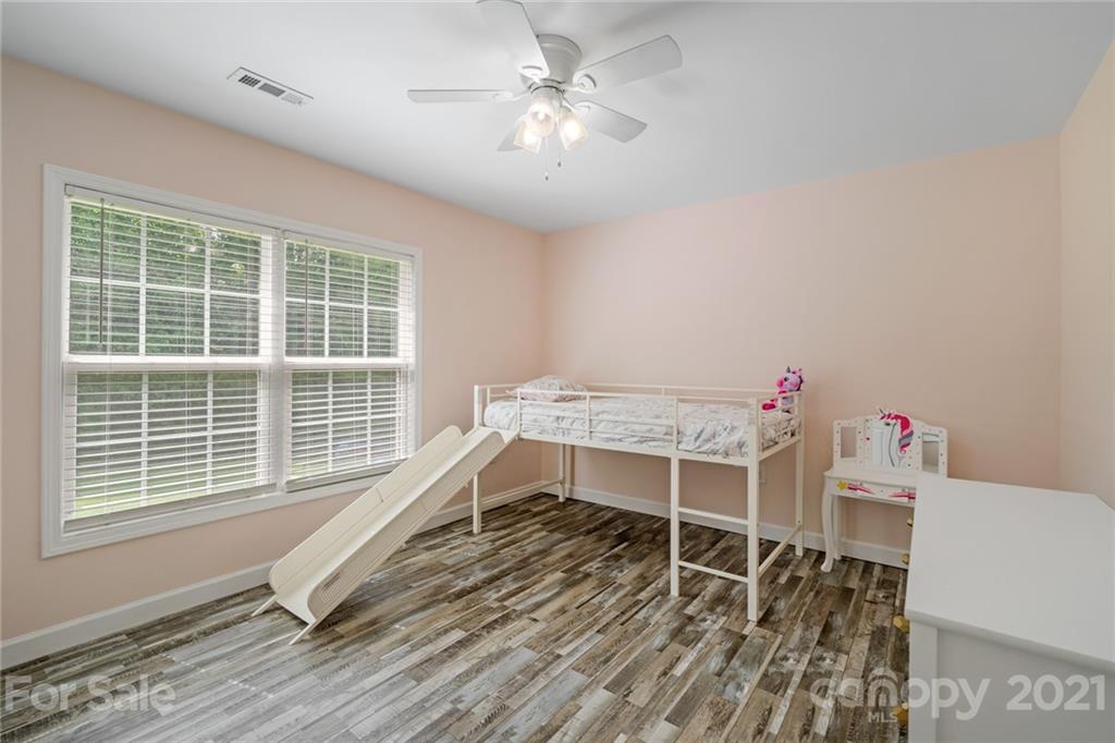 1174 South Rutherford Street Blacksburg, SC 29702 - Photo 27 of 40 a workspace with wooden floor and windows