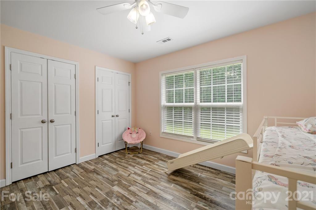 1174 South Rutherford Street Blacksburg, SC 29702 - Photo 28 of 40 a spacious bedroom with a bed and a window