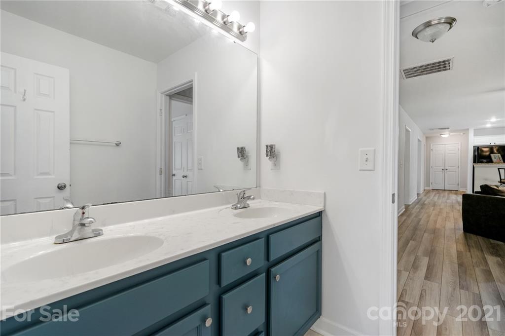 1174 South Rutherford Street Blacksburg, SC 29702 - Photo 30 of 40 a bathroom with a sink and a mirror