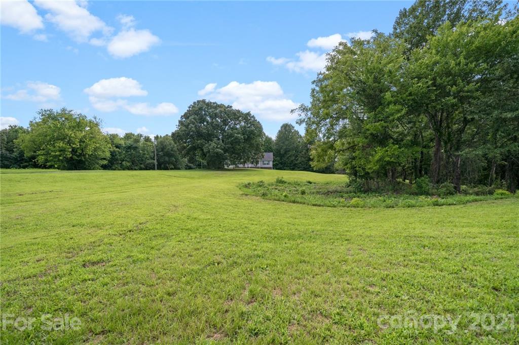 1174 South Rutherford Street Blacksburg, SC 29702 - Photo 40 of 40 a view of a field with an trees in the background