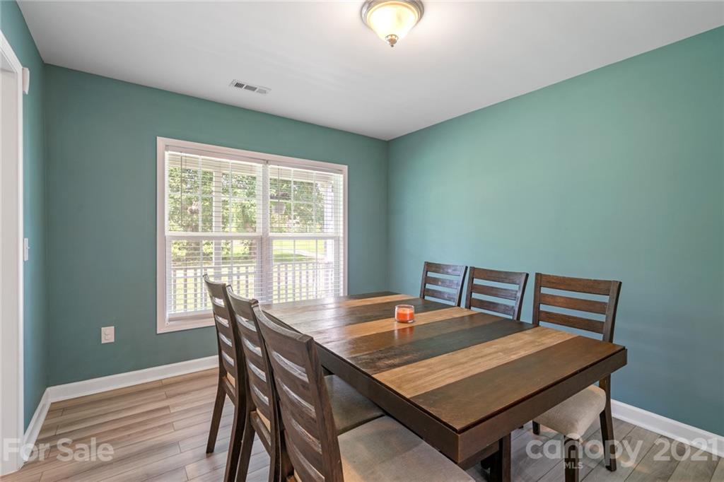 1174 South Rutherford Street Blacksburg, SC 29702 - Photo 9 of 40 a view of a dining room with a table and chairs