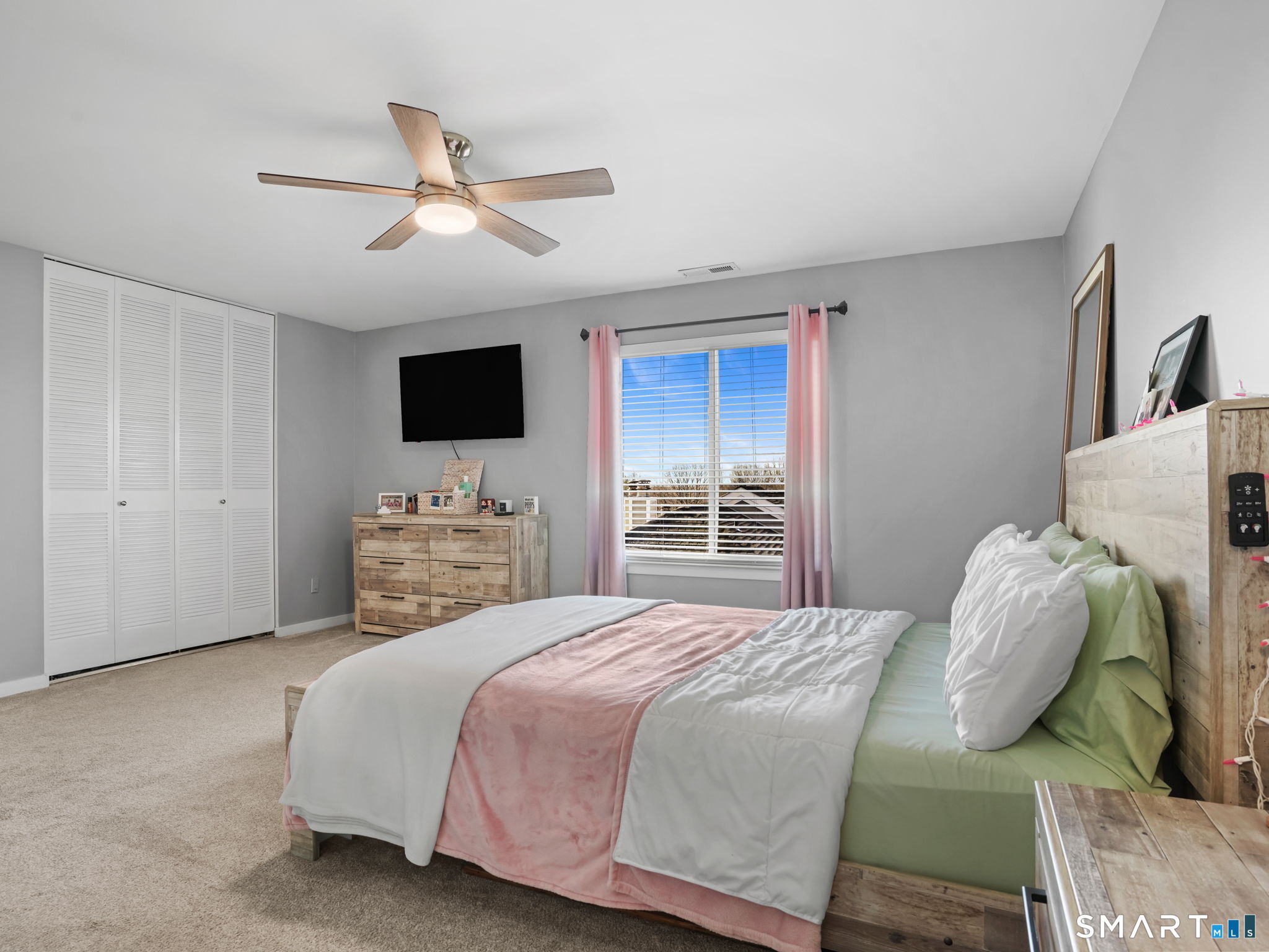 71 Aiken Street, Unit C8 Norwalk, CT 06851 - Photo 13 of 29 a bedroom with a bed and a flat screen tv