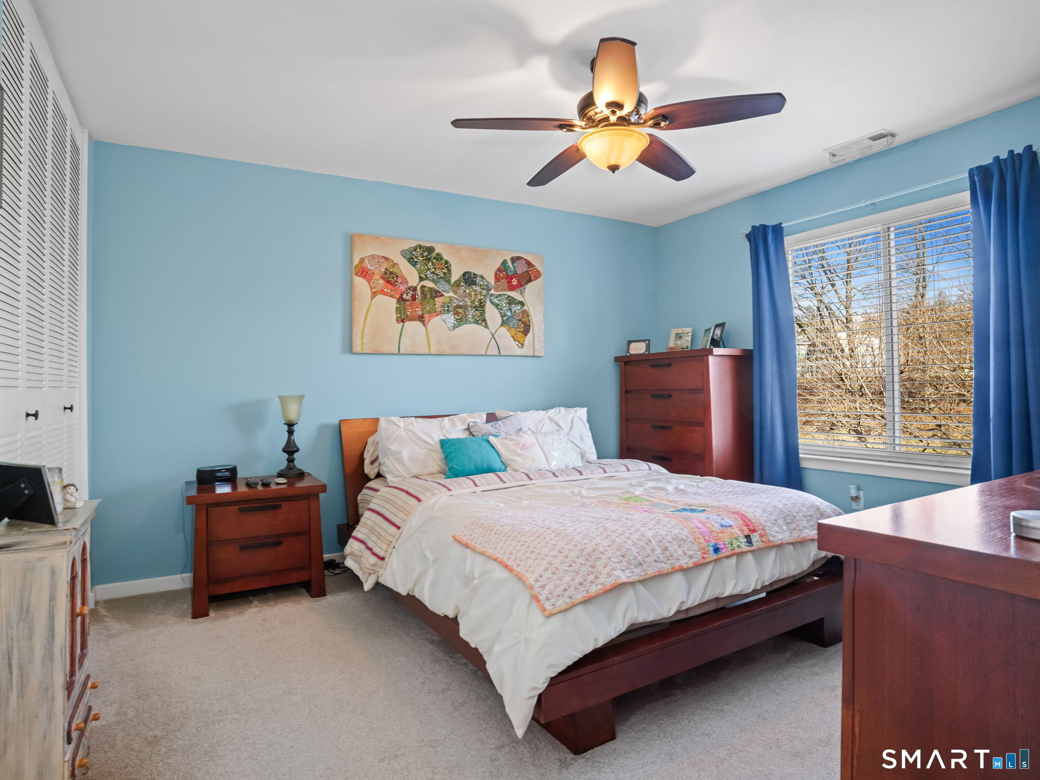 71 Aiken Street, Unit C8 Norwalk, CT 06851 - Photo 16 of 29 a bedroom with a bed and a painting on the wall