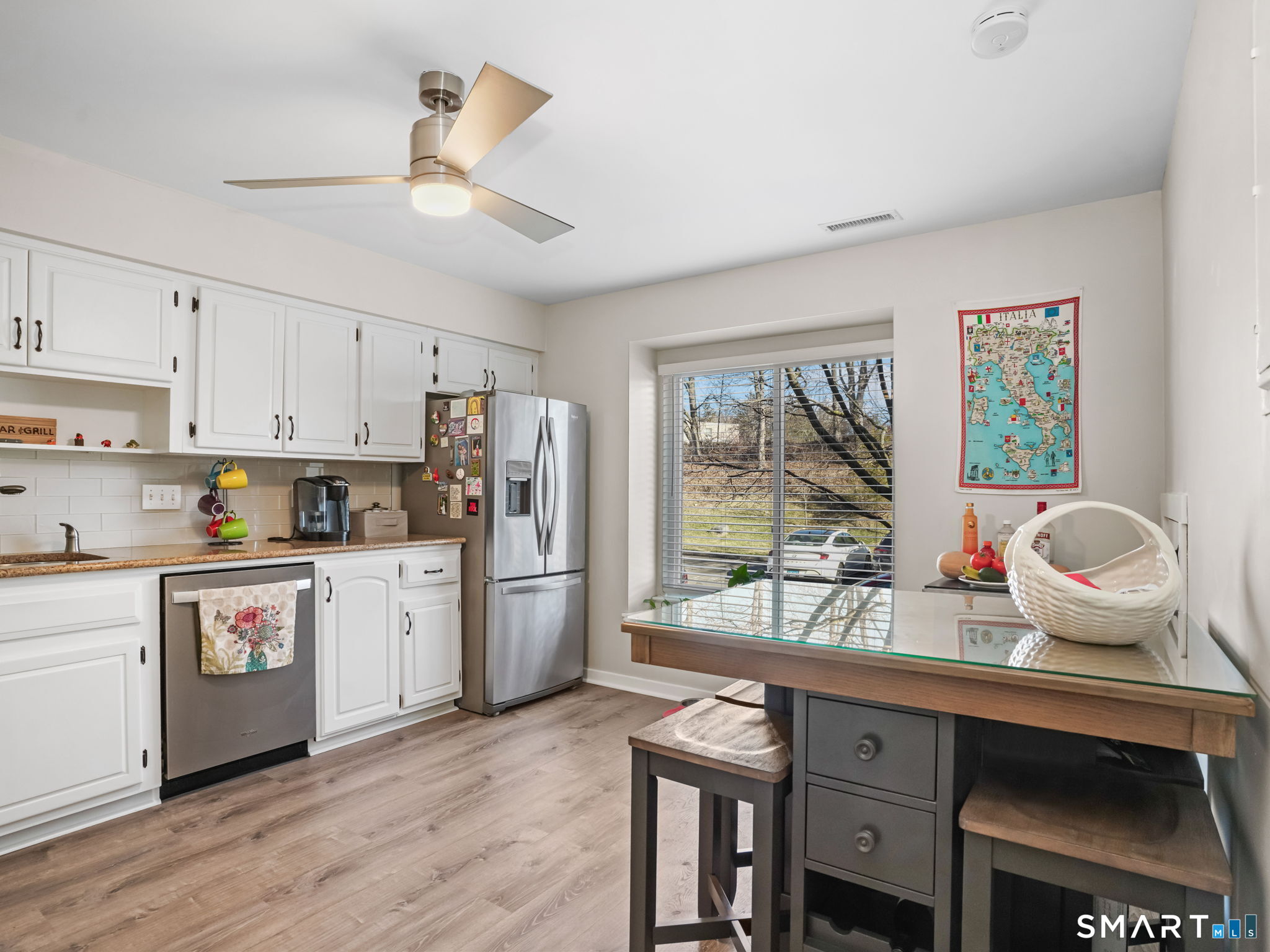 71 Aiken Street, Unit C8 Norwalk, CT 06851 - Photo 2 of 29 a kitchen with sink refrigerator and microwave