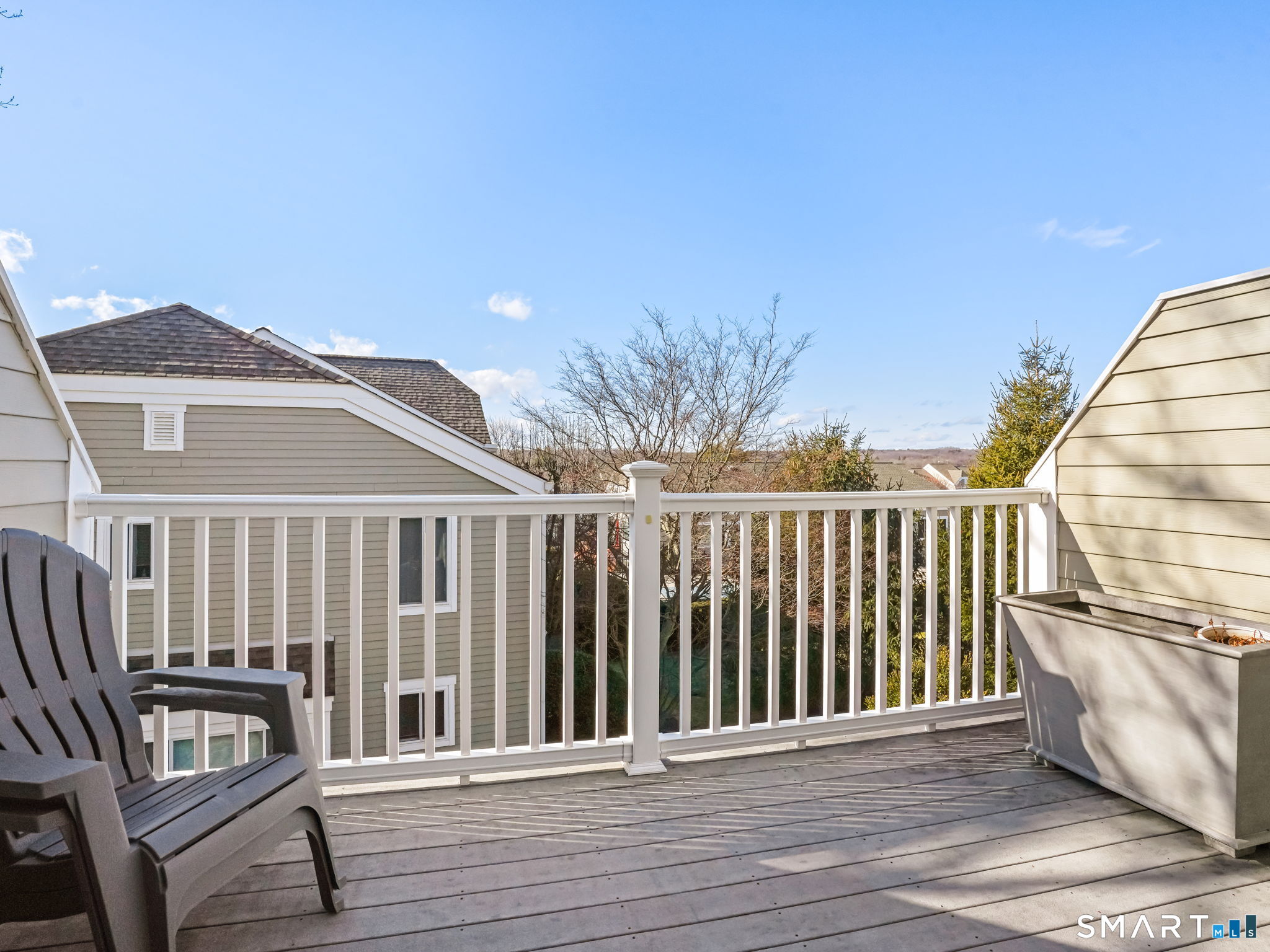 71 Aiken Street, Unit C8 Norwalk, CT 06851 - Photo 23 of 29 a balcony with wooden floor and fence