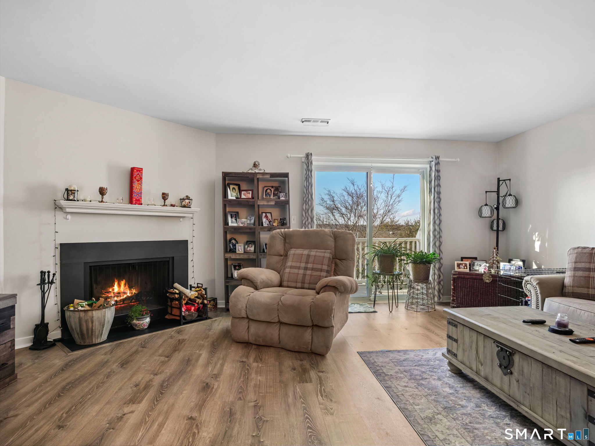 71 Aiken Street, Unit C8 Norwalk, CT 06851 - Photo 5 of 29 a living room with furniture and a fireplace