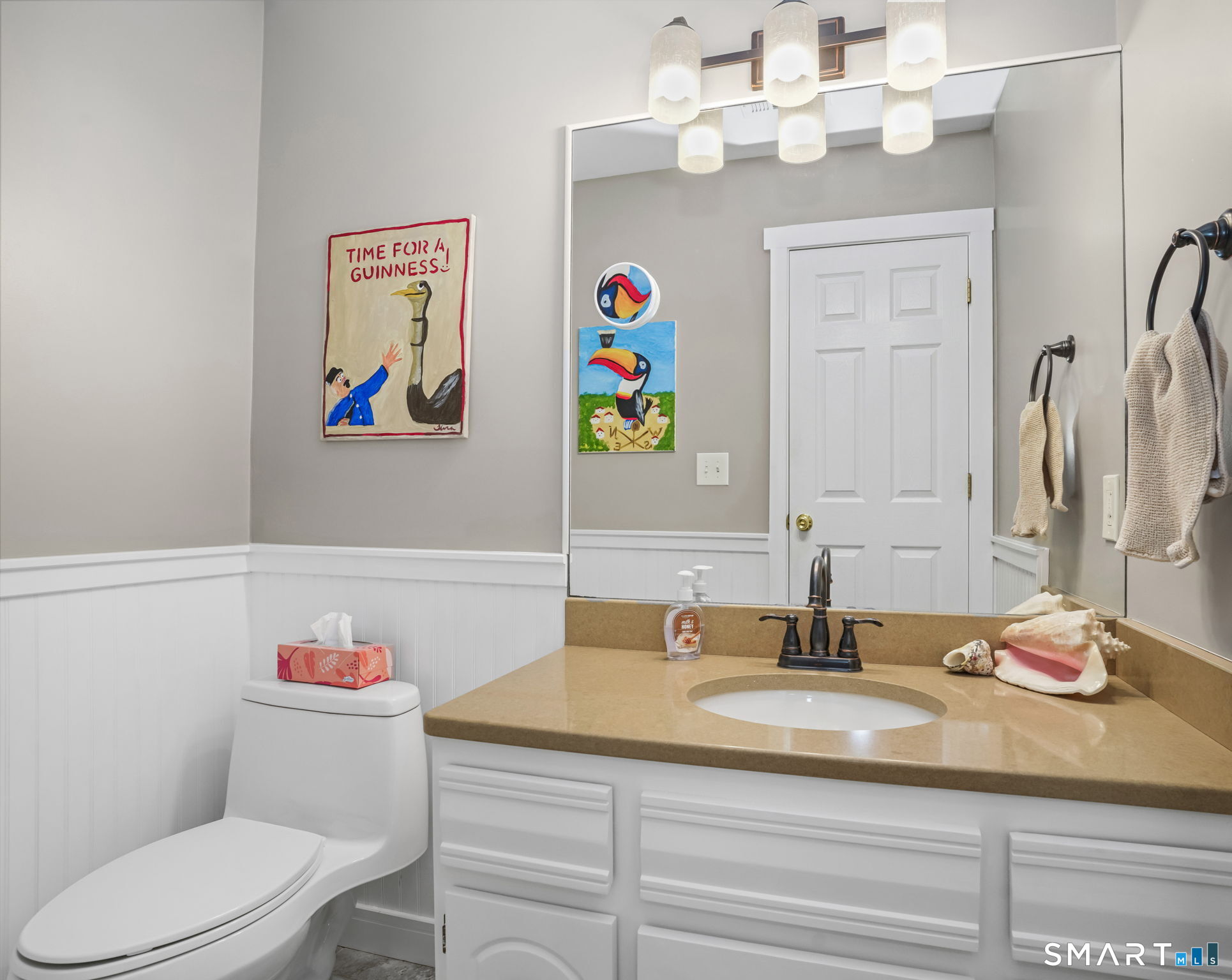 71 Aiken Street, Unit C8 Norwalk, CT 06851 - Photo 10 of 29 a bathroom with a sink a toilet and a mirror