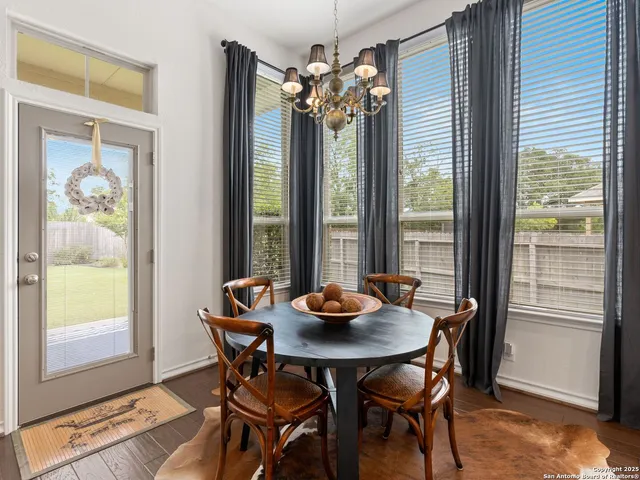 a dining room with furniture and window