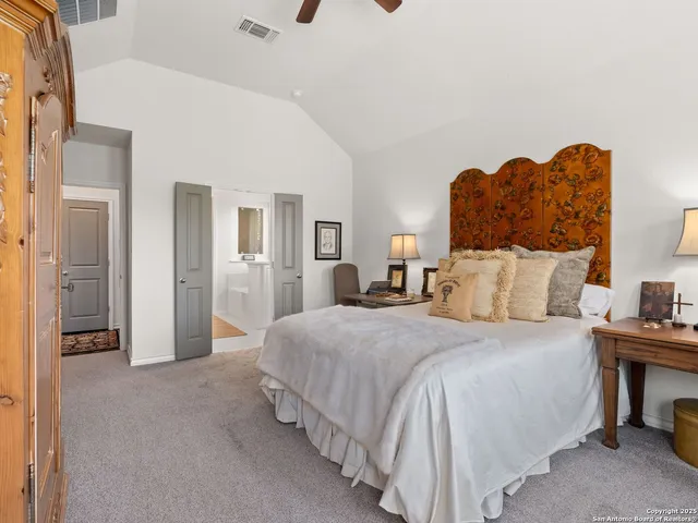 a bedroom with bed and window