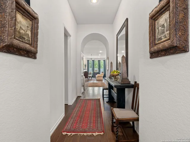 a view of a hallway with seating area