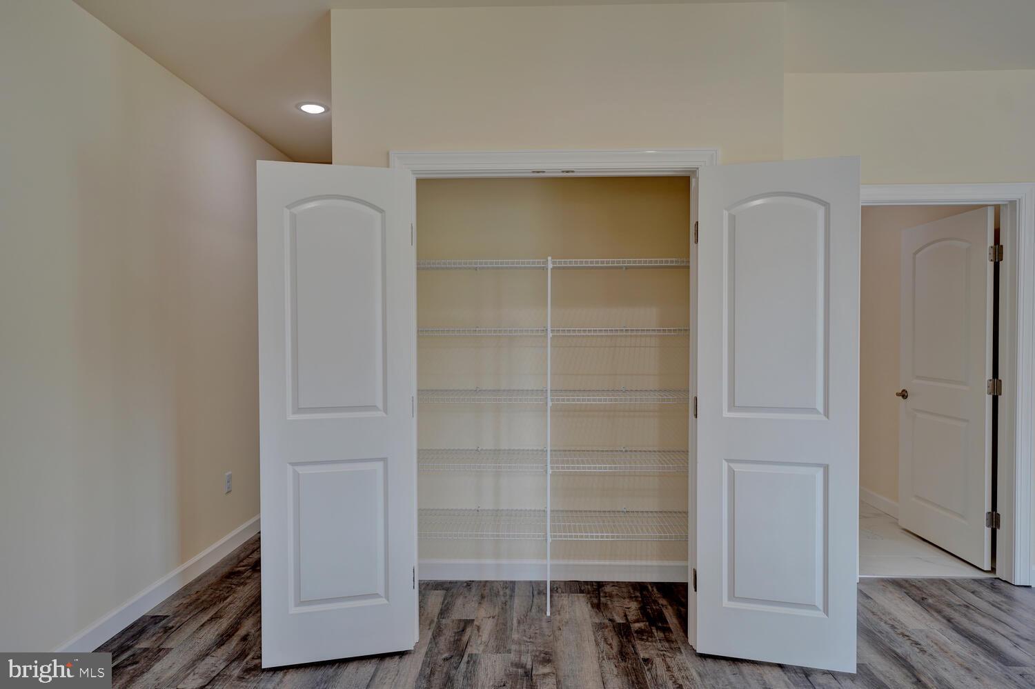 29 Mapledale Road Dover, DE 19904 - Photo 36 of 65 a view of walk in closet with empty racks