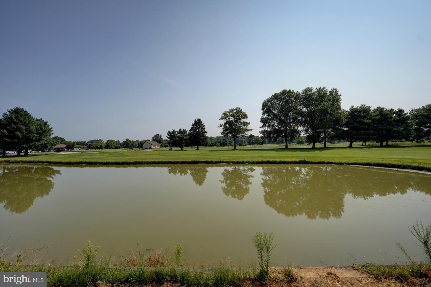 29 Mapledale Road Dover, DE 19904 - Photo 56 of 65 a view of a lake with houses in the background