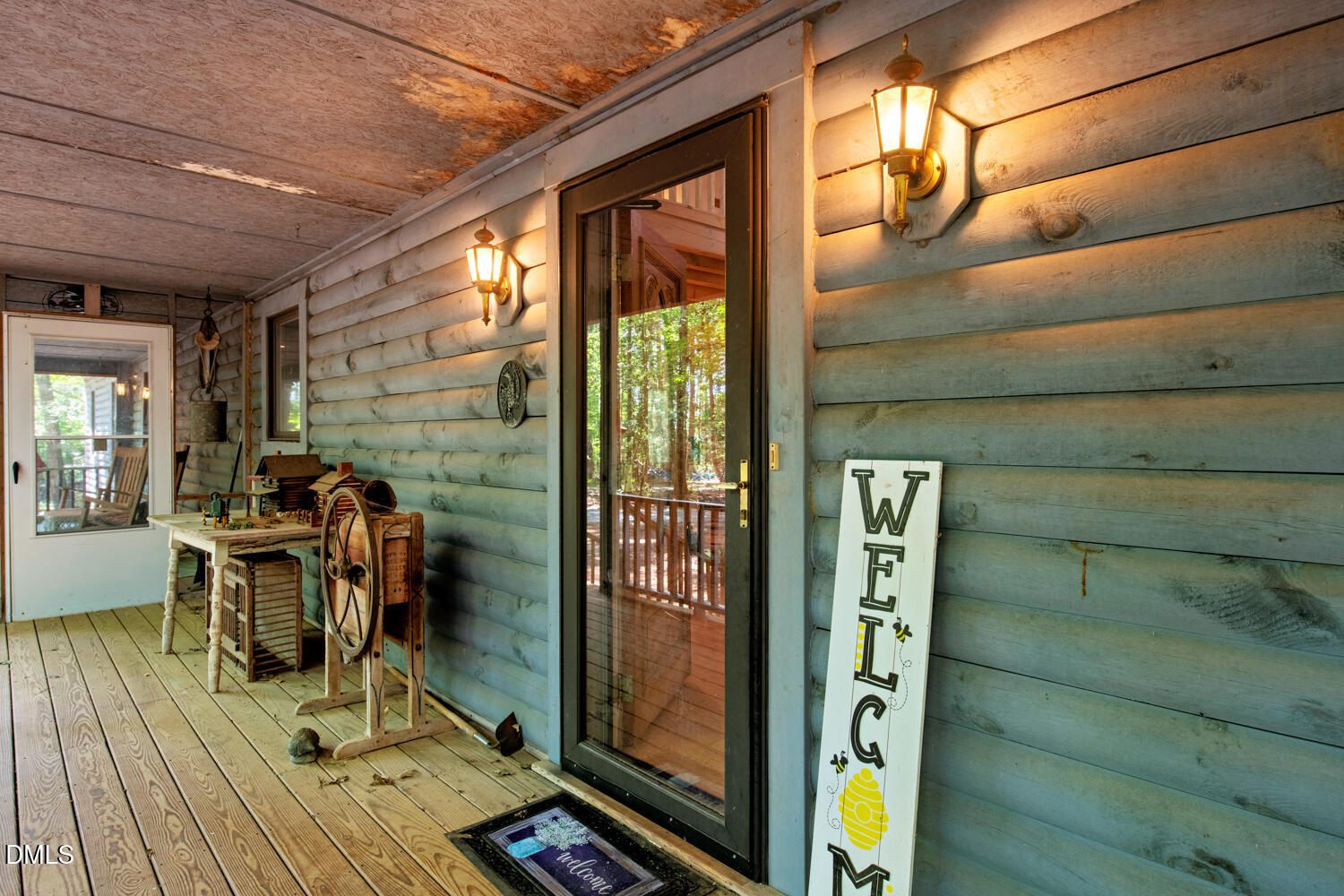 7391 Howerton Road Elon, NC 27244 - Photo 11 of 53 Spacious wooden porch with plank flooring and horizontal wood siding