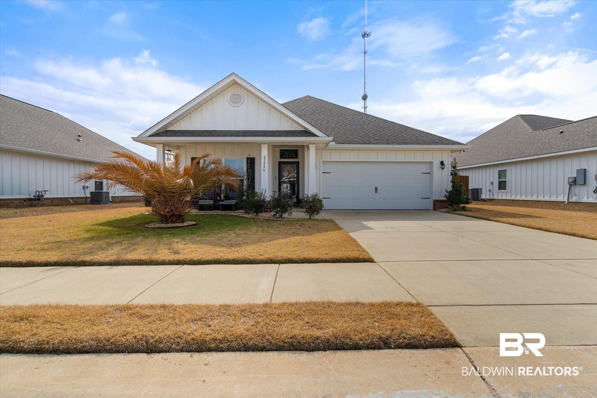 23246 Lieutenant Avenue Foley, AL 36535 - Photo 4 of 36 Single story home featuring a garage, cooling unit, and a front lawn