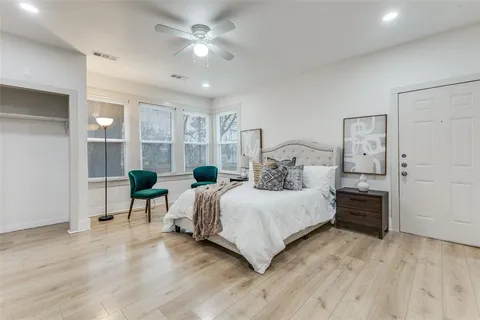 a bedroom with a bed and a view of bathroom