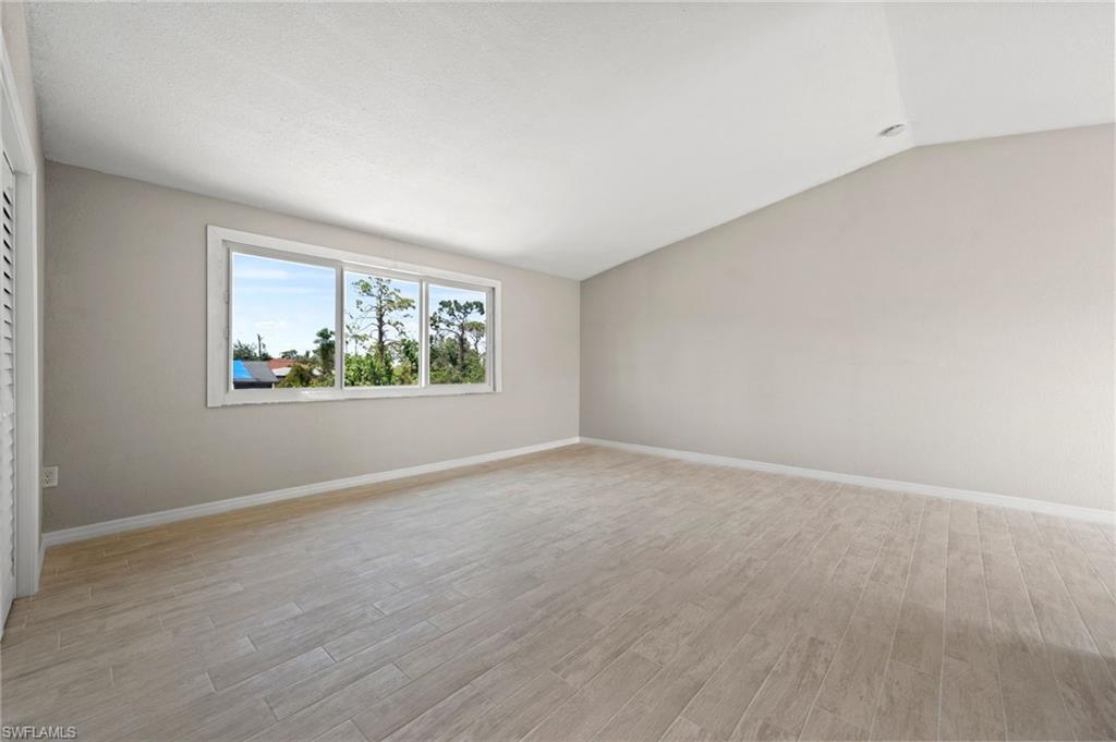 17397 Lee Road Fort Myers, FL 33967 - Photo 8 of 22 an empty room with windows