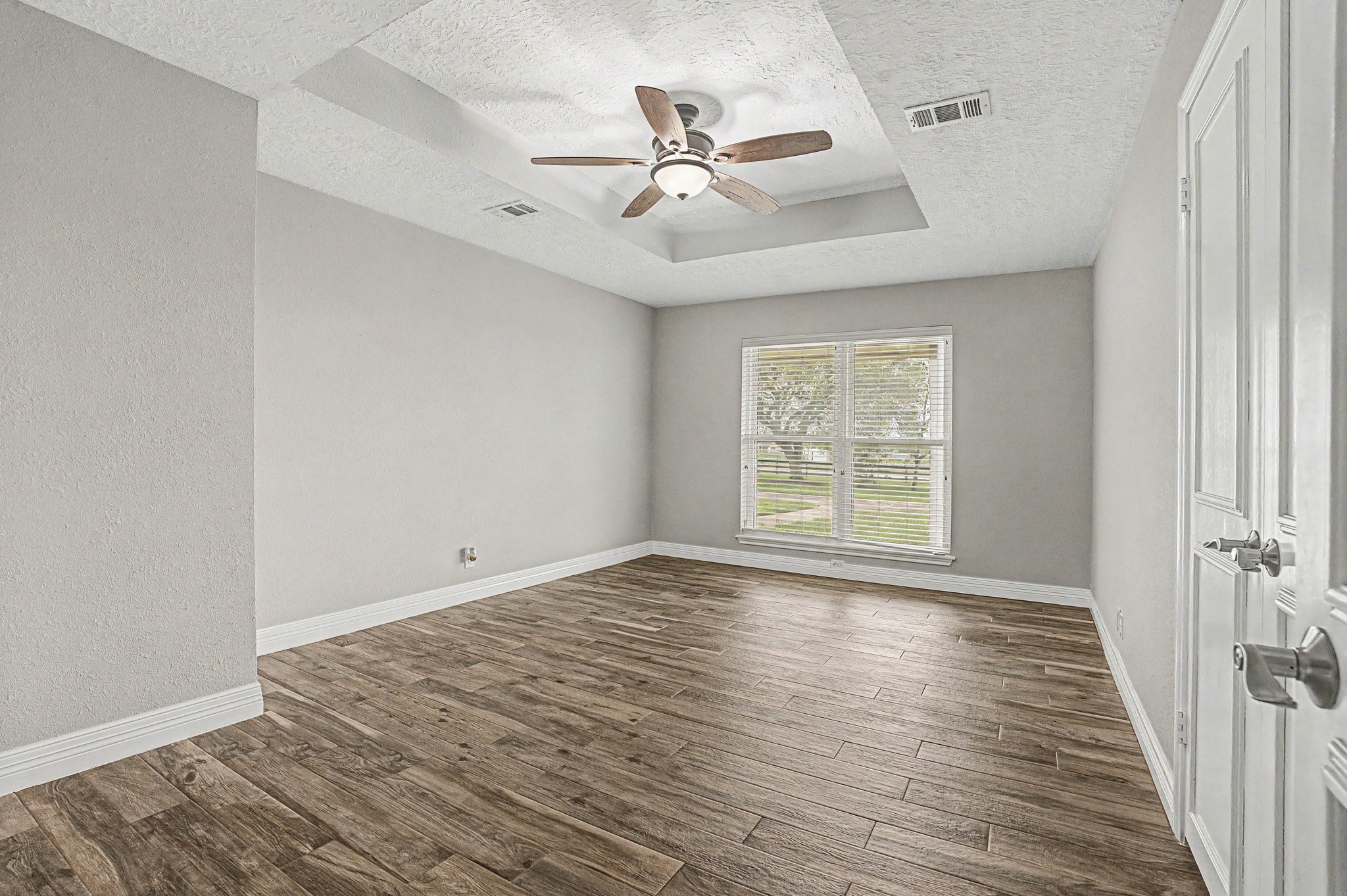 35564 Brumlow Road Hempstead, TX 77445 - Photo 21 of 46 a view of an empty room with wooden floor and a window