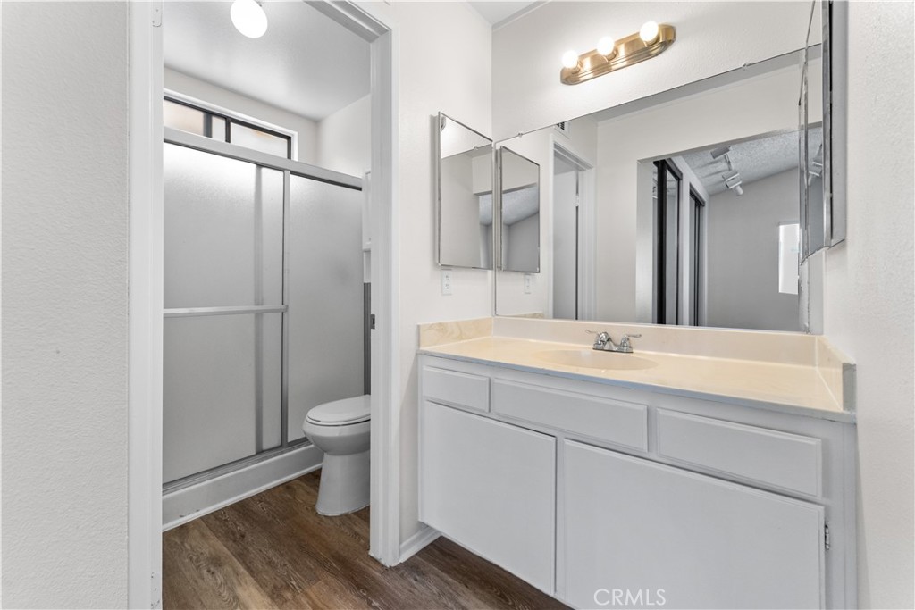1232 Kings Road Palmdale, CA 93551 - Photo 11 of 32 a bathroom with a toilet sink and mirror