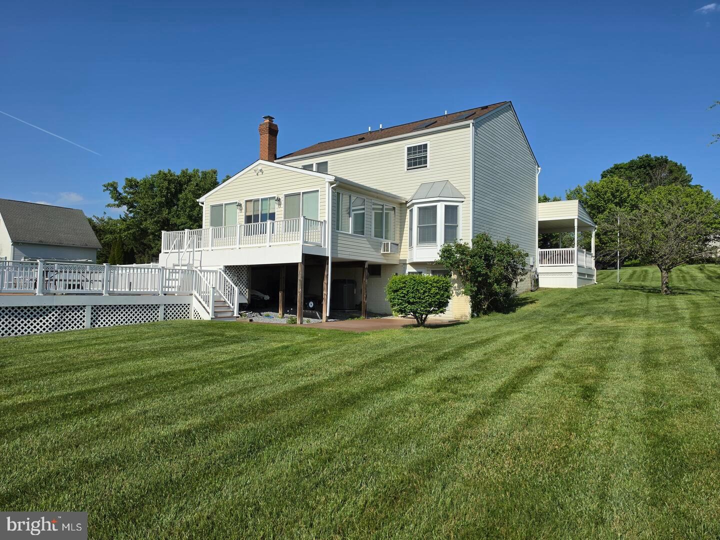 9534 Liberty Road Frederick, MD 21701 - Photo 3 of 11 a front view of a house with a yard