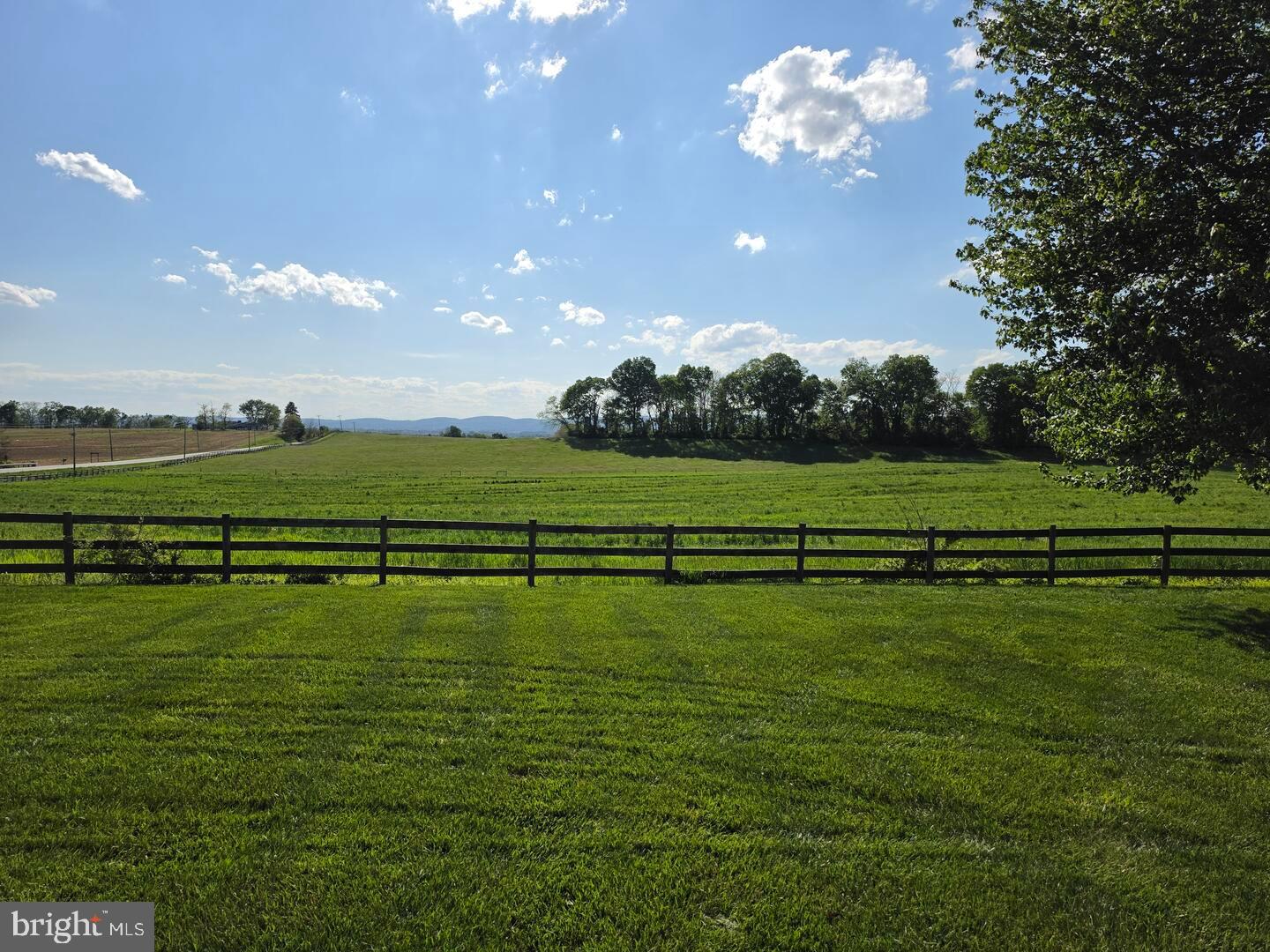 9534 Liberty Road Frederick, MD 21701 - Photo 6 of 11 a view of a golf course with a lake
