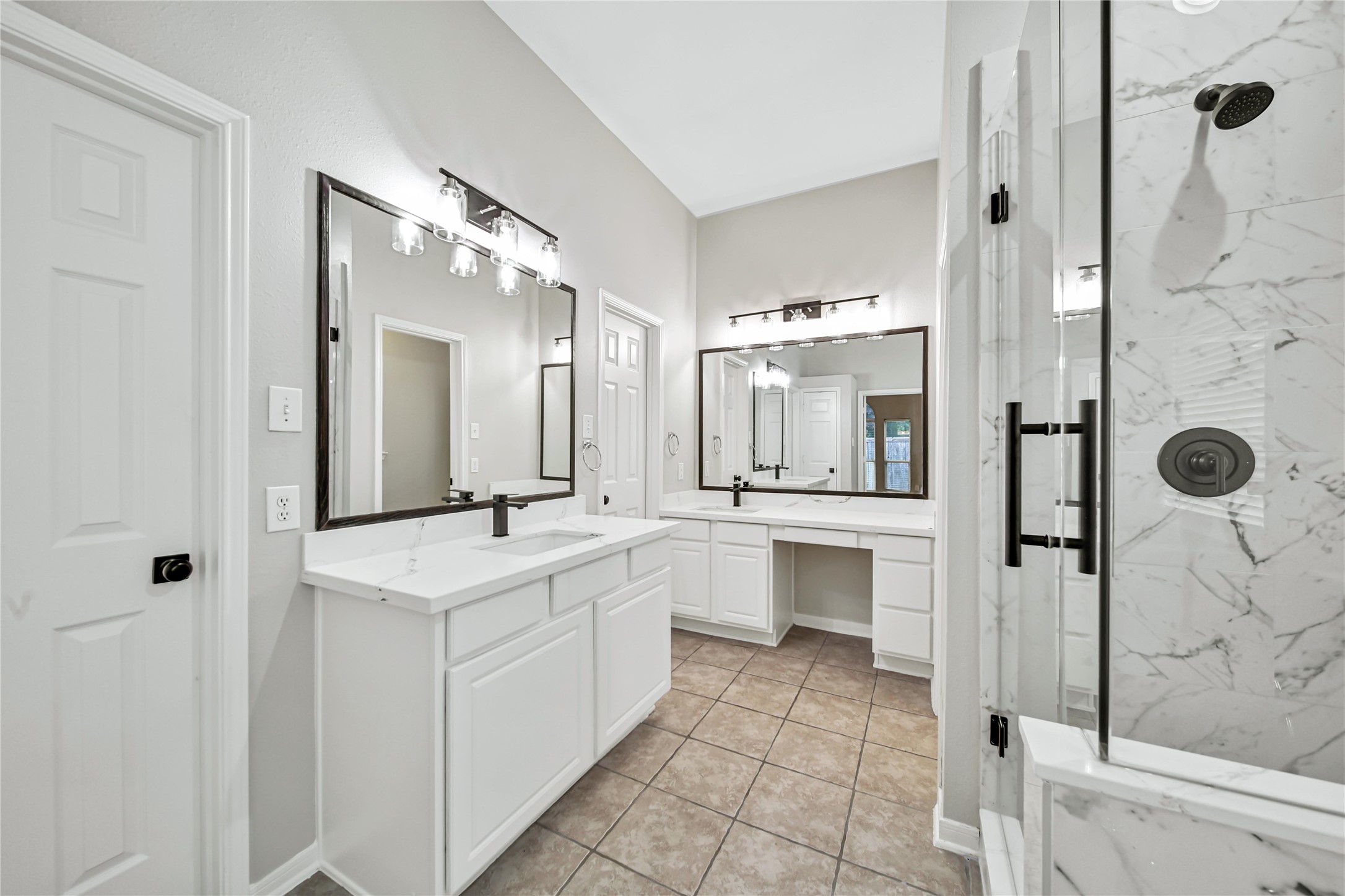 14526 Red Tailed Hawk Lane Houston, TX 77044 - Photo 24 of 40 a bathroom with a double vanity sink mirror and shower