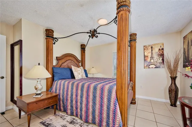 a bedroom with bed and a window