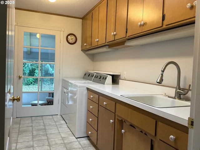 a kitchen with a sink and cabinets