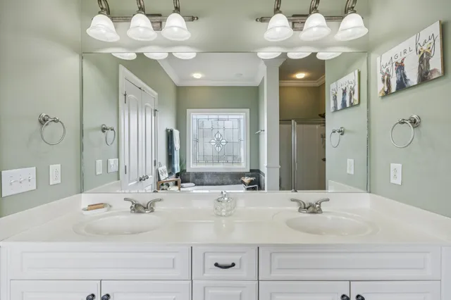 a bathroom with a tub and a window