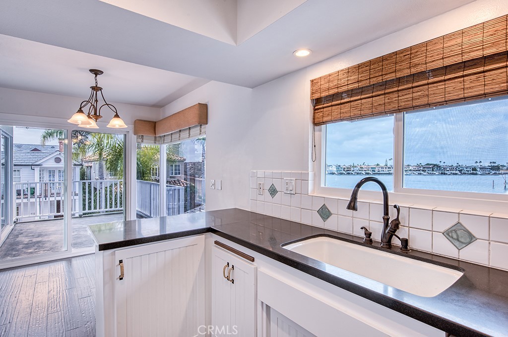 2712 Shell Street Corona del Mar, CA 92625 - Photo 7 of 18 a kitchen with a sink and a large window