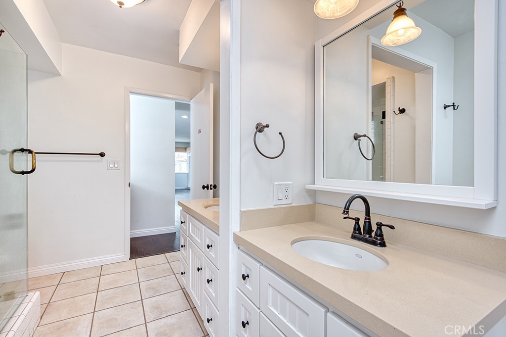 2712 Shell Street Corona del Mar, CA 92625 - Photo 10 of 18 a bathroom with a sink and a mirror