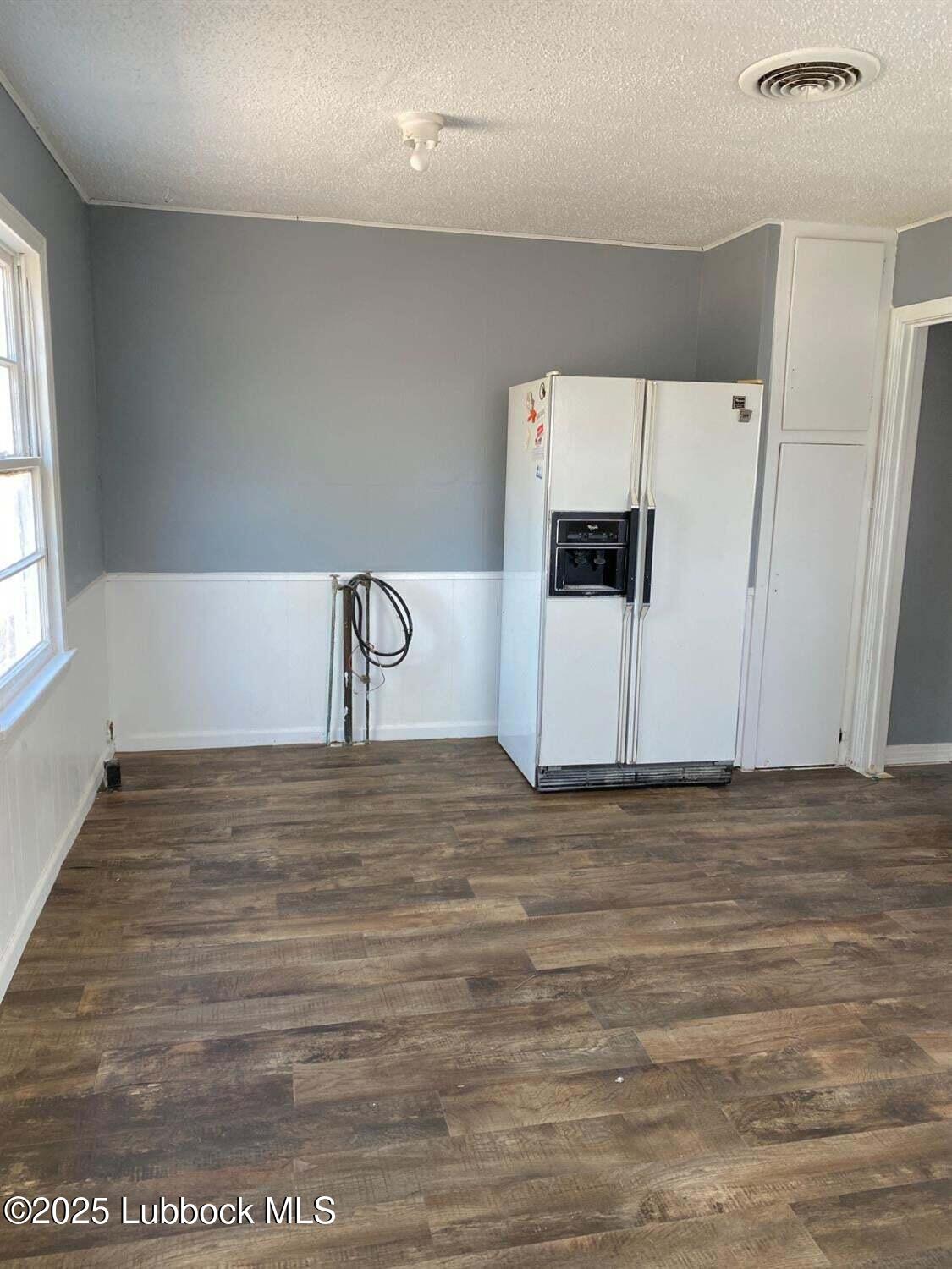 1917 39th Street Lubbock, TX 79412 - Photo 4 of 7 a view of empty room with cabinet and window