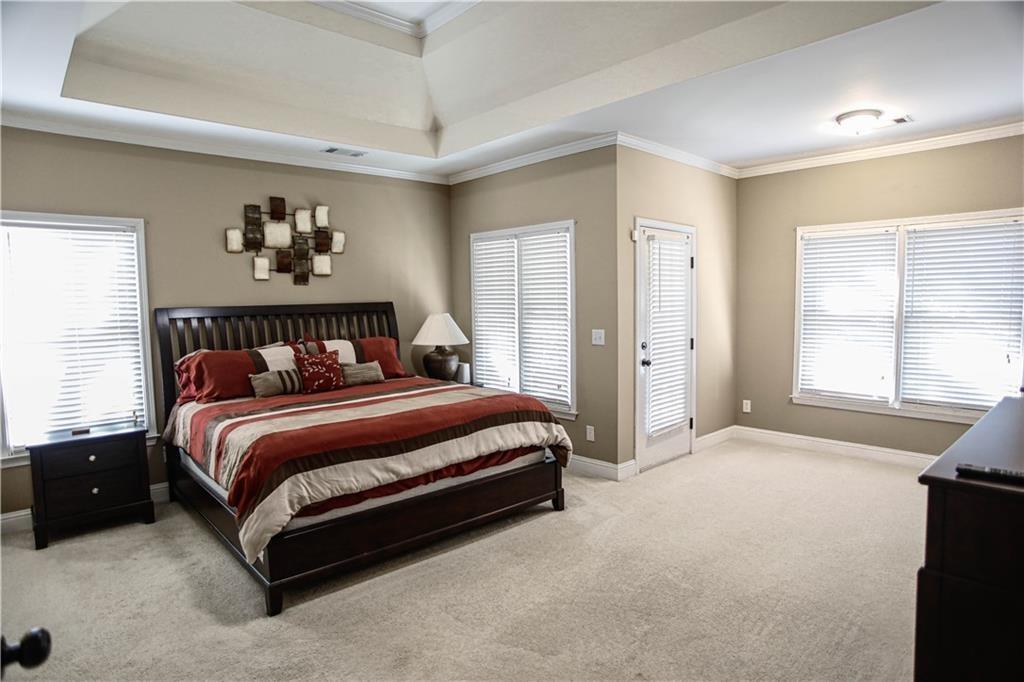3875 Spring Manor Court Loganville, GA 30052 - Photo 17 of 23 a bedroom with a bed and window